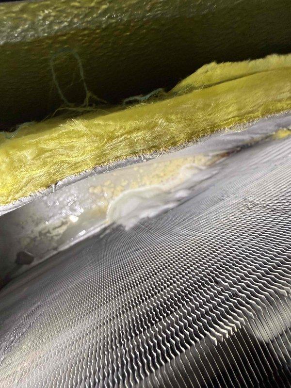 Responded to no cooling complaint on 4-year-old single system. Upon inspection, discovered extensive ice buildup covering the entire evaporator coil surface. Heavy frost accumulation was preventing proper airflow across the coil fins, resulting in loss of cooling capacity. Identified restricted airflow as the primary cause, with filter showing significant debris accumulation and compression. System had received spring maintenance two days prior, indicating rapid development of the freezing condition. Shut down system to allow complete defrost of evaporator coil. Replaced dirty air filter with new filter to restore proper airflow. Verified all refrigerant line insulation intact on copper lines connected to coil assembly. Once coil fully defrosted, restarted system and monitored operation. Confirmed proper airflow restoration and normal cooling cycle resumption. System returned to normal operating parameters with adequate temperature differential across coil.