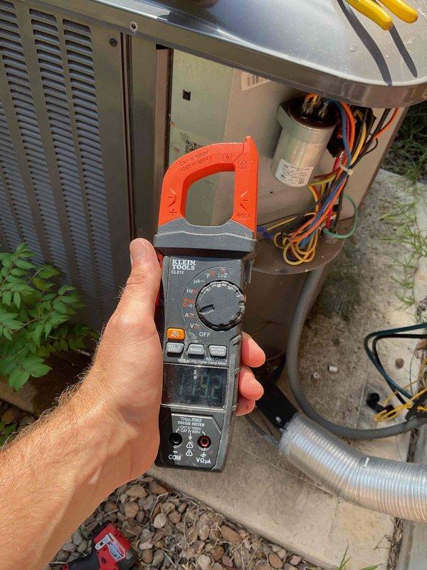 Completed routine spring member maintenance on a 5-year-old single HVAC system located in the attic. Performed comprehensive inspection of evaporator coil assembly, confirming proper operation with adequate condensation present on coil fins and no visible debris or contamination. Accessed outdoor condensing unit, inspected electrical connections and wiring, and tested capacitor functionality using clamp meter to verify proper amperage draw and system performance. System operating within normal parameters with no issues identified; standard preventative maintenance procedures completed successfully.