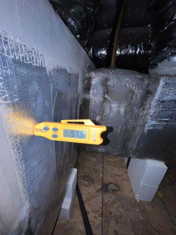 Completed comprehensive preventive maintenance on a 9-year-old single HVAC system located in attic space. Performed full system inspection including checking refrigerant levels, cleaning condenser coils, testing electrical connections at outdoor disconnect, verifying thermostat calibration with temperature readings showing 57.3°F, inspecting ductwork and insulation, and ensuring all components were operating within manufacturer specifications. System found to be performing adequately with no immediate concerns identified.