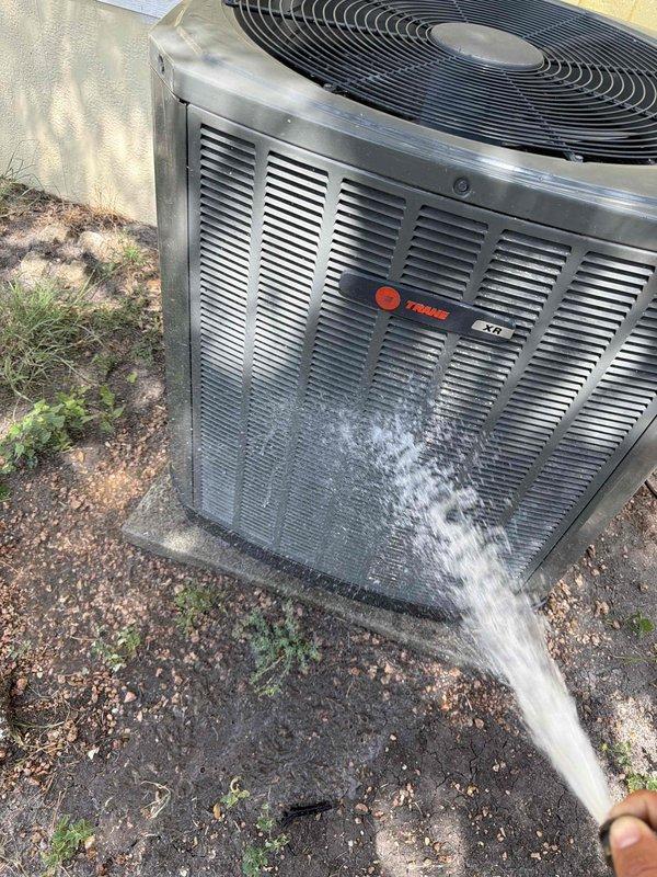 Completed spring maintenance on a 4-year-old Trane XV single-stage air conditioning system located in interior closet. Performed comprehensive inspection with particular focus on capacitor and contactor that were replaced five months prior during fall maintenance. Verified both components are operating within specifications and showing no signs of premature wear or pitting. 

Cleaned outdoor condenser coil using water spray to remove accumulated dirt, debris, and dust buildup from unit's exterior surfaces and fins. Measured and recorded system amperage at 46.9 amps using clamp meter, confirming proper electrical draw. Inspected all electrical connections for tightness and signs of overheating. Checked refrigerant pressures and verified system is operating efficiently with proper superheat and subcooling values.

Inspected condensate drain line for proper flow and cleared any blockages. Verified thermostat operation and calibration. Checked air filter condition and confirmed adequate ai