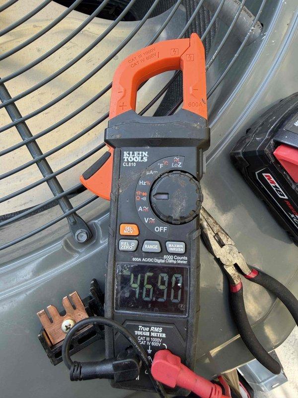 Completed spring maintenance on a 4-year-old Trane XV single-stage air conditioning system located in interior closet. Performed comprehensive inspection with particular focus on capacitor and contactor that were replaced five months prior during fall maintenance. Verified both components are operating within specifications and showing no signs of premature wear or pitting. 

Cleaned outdoor condenser coil using water spray to remove accumulated dirt, debris, and dust buildup from unit's exterior surfaces and fins. Measured and recorded system amperage at 46.9 amps using clamp meter, confirming proper electrical draw. Inspected all electrical connections for tightness and signs of overheating. Checked refrigerant pressures and verified system is operating efficiently with proper superheat and subcooling values.

Inspected condensate drain line for proper flow and cleared any blockages. Verified thermostat operation and calibration. Checked air filter condition and confirmed adequate ai