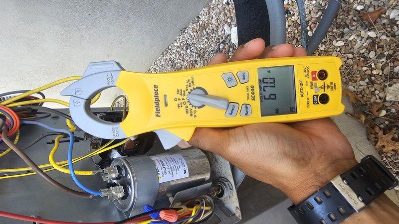 Responded to no cooling call with upstairs temperature reaching 93 degrees on a 2-6 year old attic system. Upon arrival, performed electrical diagnostics on the outdoor unit's capacitor and associated components using clamp meter. Measured amperage draw and verified capacitor performance, testing terminal connections and electrical values. System evaluated and measurements documented to determine proper operation of electrical components and refrigerant circuit functionality.
