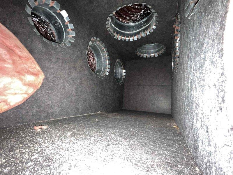Completed comprehensive member maintenance inspection on single HVAC system serving 2,926 square foot residence. System is approximately 5 years old with no documented prior maintenance history. 

Performed full visual inspection of heating system components including burner assembly chamber. Observed four burner assemblies with metallic rims in proper configuration. Noted moderate accumulation of dust and particulate matter on interior surfaces and chamber floor, consistent with lack of previous maintenance. Inspected heat exchanger area and adjacent insulation material for signs of deterioration or damage—no significant concerns identified. Evaluated combustion chamber condition and verified structural integrity of all visible components.

Inspected ventilation system components including Aprilaire active ventilation controller. Verified proper wiring connections and controller mounting. Assessed copper refrigerant line routing and condition—no visible corrosion, damage, or refrigera