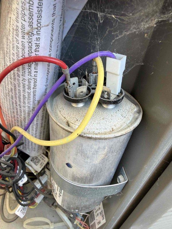 Responded to no-cooling call on 3-4 year old Lennox ML14XP1-048 split system in 2,714 square foot residential property. Upon arrival, confirmed outdoor condensing unit was not energizing despite thermostat calling for cooling. Performed systematic diagnostic evaluation of electrical components at outdoor unit. Tested dual run capacitor with multimeter and identified failed capacitor with readings outside manufacturer specifications. Capacitor showed no measurable capacitance on common-to-compressor terminal, preventing compressor from starting. Removed defective capacitor and installed OEM-equivalent replacement capacitor with proper microfarad ratings for both compressor and condenser fan motor circuits. Verified all wire connections were secure at capacitor terminals and contactor. Restored power to system and cycled unit through complete cooling operation. Confirmed compressor engaged properly, condenser fan motor operated at correct speed, and system achieved normal operating press