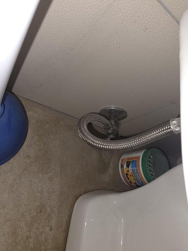 Responded to guest bathroom with toilet running continuously and producing loud squeaking noise. Inspected 19-year-old toilet fixture with water supply already shut off at angle stop valve. Diagnosed faulty fill valve assembly causing constant water flow and ballcock mechanism creating squeaking sound. Replaced complete fill valve assembly and flapper to restore proper operation. Tested flush cycle multiple times to verify silent operation and proper shut-off. Addressed bathroom sink issue during same visit, ensuring all fixtures functioning correctly before departure.