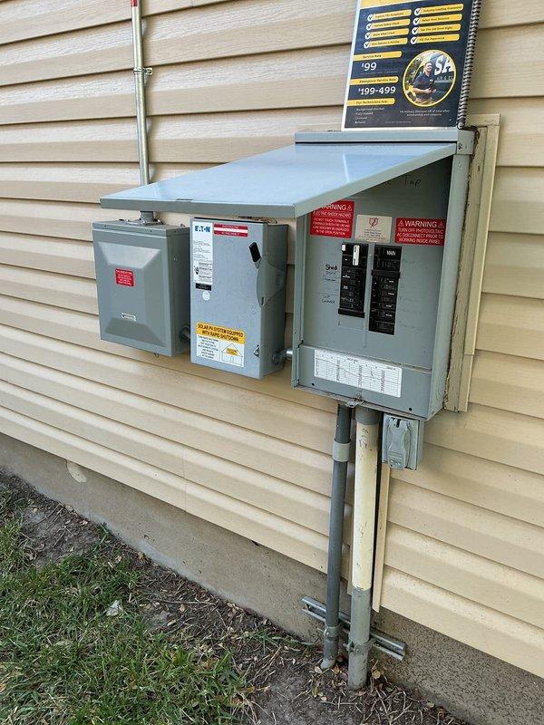 Responded to customer report of exterior breaker tripping approximately once per week. Inspected exterior electrical service panel and disconnect switch mounted on building exterior. Evaluated circuit breaker configuration, panel condition, and electrical connections. Documented existing Eaton disconnect and main panel installation with photographic evidence. Inspected interior smoke/carbon monoxide detector as part of comprehensive electrical safety assessment. All components found in serviceable condition with no visible damage or deterioration to equipment or conduit connections.