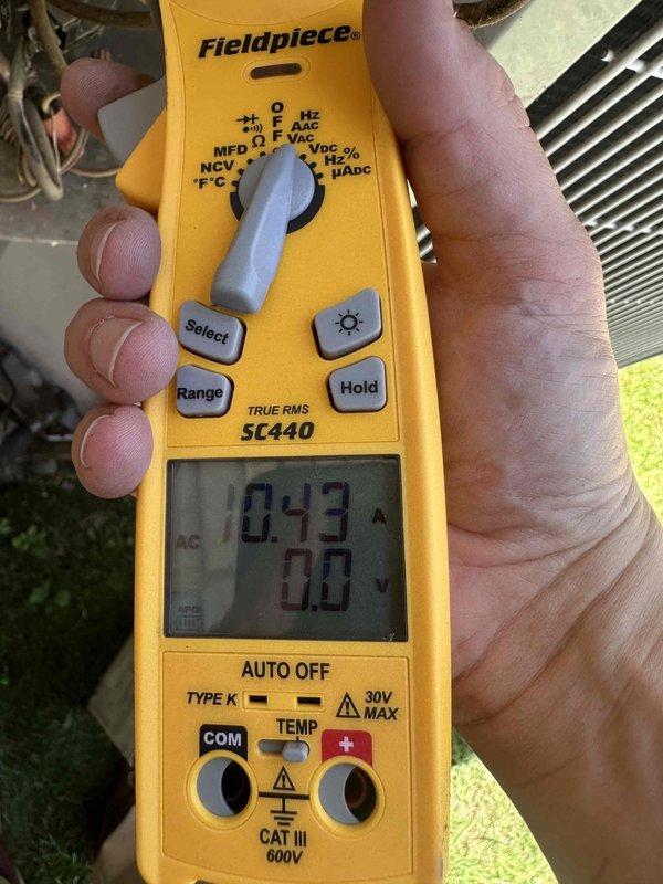 Completed fall maintenance on a 5-year-old Carrier HVAC system located in the attic of a 20-year-old residence. Accessed attic-mounted air handler and performed comprehensive seasonal inspection per manufacturer specifications. Measured and recorded system amperage at 10.43A using calibrated clamp meter, indicating normal operating current draw. Verified voltage readings at 0.0V on secondary circuit during testing sequence. Inspected all accessible ductwork connections and confirmed proper sealing of reflective insulation. Examined condensate drain pan and drainage system for proper function and cleared any debris. Verified all safety labels and manufacturer specifications remain legible on unit exterior. System operating within normal parameters with no immediate service needs identified.