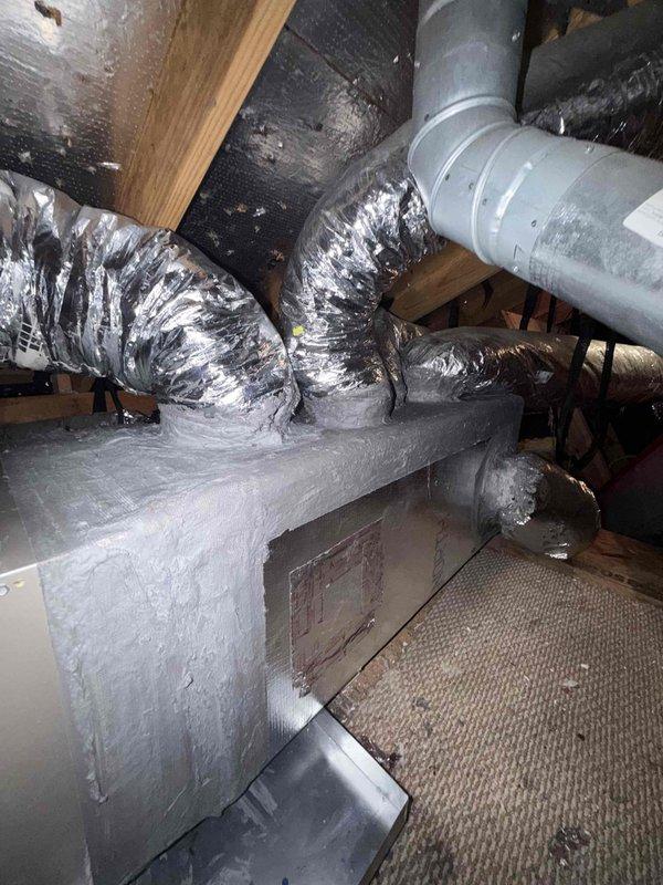 Completed warranty replacement of supply plenum in attic space. Arrived on-site first thing in the morning, accessed attic area, and took measurements of existing supply plenum and connected duct sizes. Retrieved necessary materials and returned to complete full installation same day. Removed old supply plenum, installed new metal supply plenum, and reconnected all flexible ductwork branches to new plenum using proper sealing methods and metallic tape. Verified all duct connections were secure and system was operational before completing work.