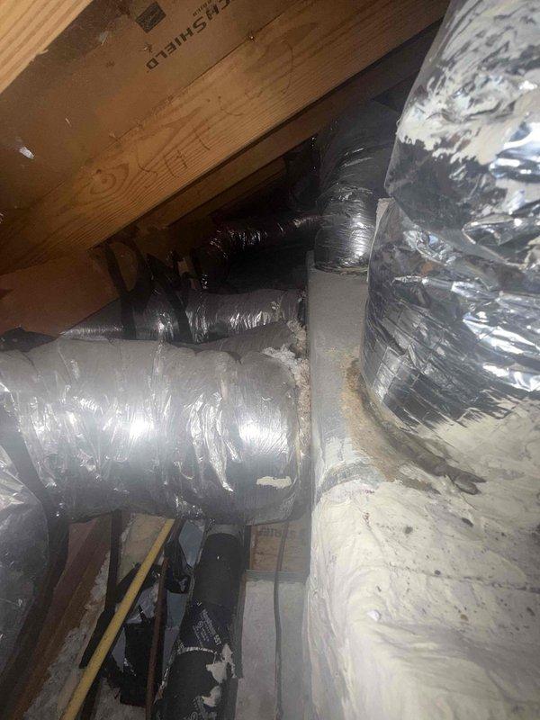 Completed warranty replacement of supply plenum in attic space. Arrived on-site first thing in the morning, accessed attic area, and took measurements of existing supply plenum and connected duct sizes. Retrieved necessary materials and returned to complete full installation same day. Removed old supply plenum, installed new metal supply plenum, and reconnected all flexible ductwork branches to new plenum using proper sealing methods and metallic tape. Verified all duct connections were secure and system was operational before completing work.