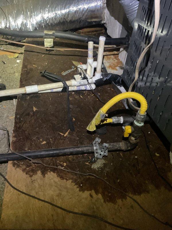 # HVAC Drain Line Service

Responded to service call for HVAC drain issue at 1992 residential property. Upon inspection, located air handler in attic space and identified drainage system concerns. Drain line showed evidence of debris accumulation and potential blockage affecting proper condensate removal. Cleared obstruction from condensate drain line using appropriate methods. Verified proper drainage flow through primary and secondary drain systems. Inspected drain pan for standing water and confirmed adequate pitch for drainage. Tested system operation to ensure condensate was flowing freely through discharge lines. System returned to normal operation with proper drainage function restored.