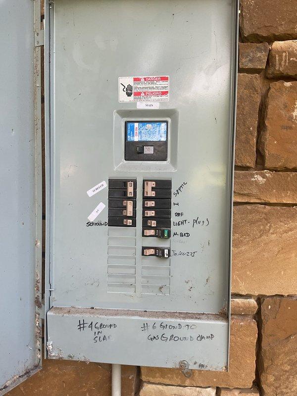 Responded to service call for multiple non-functioning outlets and fan switches in 16-year-old residence. Upon arrival, conducted comprehensive electrical system diagnosis including inspection of outdoor GFCI outlets and interior circuit distribution. Evaluated main electrical panel with digital monitoring system, identifying tripped breakers and circuit overload conditions affecting bedroom outlets, outdoor receptacles, and fan control circuits. Tested all affected circuits for continuity, proper grounding, and voltage irregularities. Reset tripped breakers labeled for septic system, master bedroom, and exterior lighting/plug circuits. Verified proper operation of ground fault protection on outdoor outlets per NEC requirements. Inspected exterior electrical conduit and grounding wire installation along foundation for damage or deterioration. Confirmed all circuits restored to normal operation, tested outlets for proper polarity and grounding, and verified fan switch functionality thro