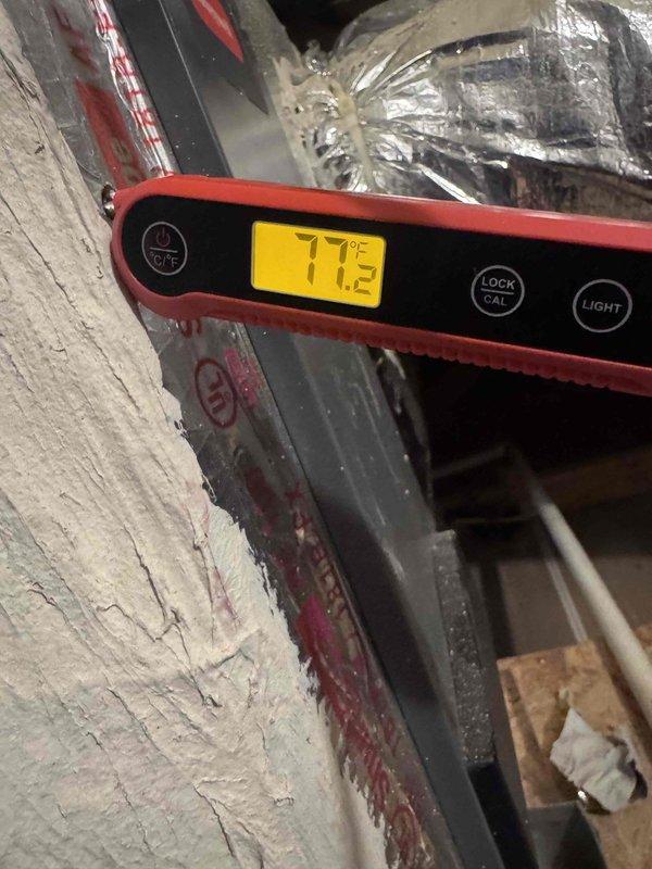 Performed complimentary leak search on residential air conditioning system. Conducted thorough inspection of outdoor condenser unit and associated refrigerant lines using diagnostic equipment. Documented system conditions with photographs showing unit configuration, pressure testing setup, and attic ductwork temperature readings of 77.2°F. Coordinated with team regarding customer's interest in proceeding with additional recommended work based on findings.
