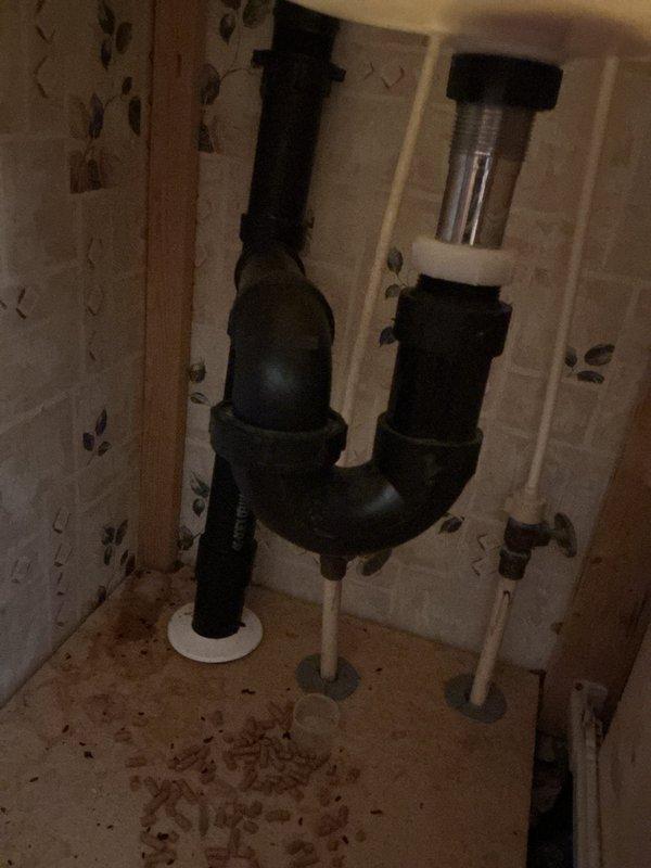 Performed water heater flush service on electric tank-type water heater located in bedroom closet. Unit is over 10 years old and showing signs of age with visible corrosion on brass fittings and pressure relief components. Completed standard flush procedure, inspected all plumbing connections at top of unit including hot and cold supply lines, temperature/pressure relief valve, and associated piping, and documented current condition of system for homeowner's records.