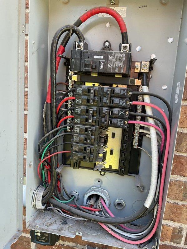 Responded to loss of power in garage at a 10-year-old residential property. Inspected main electrical panel and garage subpanel, documenting current wiring configurations and circuit breaker arrangements. Found properly organized circuits with labeled breakers and color-coded wiring following standard electrical conventions. Verified main service connections, branch circuit integrity, and proper grounding. All electrical components appeared functional with no visible signs of damage, though panels showed normal wear from use. Traced circuits to identify affected areas and restored power to garage.
