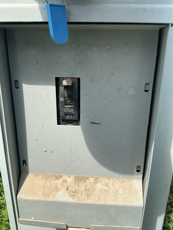 Installed outdoor power inlet box with 25-amp circuit breaker for generator connection at residential property. Connected new inlet box to existing main electrical panel, establishing safe transfer point for portable generator power. Assessed main panel condition during connection work, noting accumulated dust and debris throughout interior components. Verified proper breaker sizing and secure terminations at both inlet box and main panel locations. Installation provides homeowner with code-compliant generator hookup capability for backup power needs.