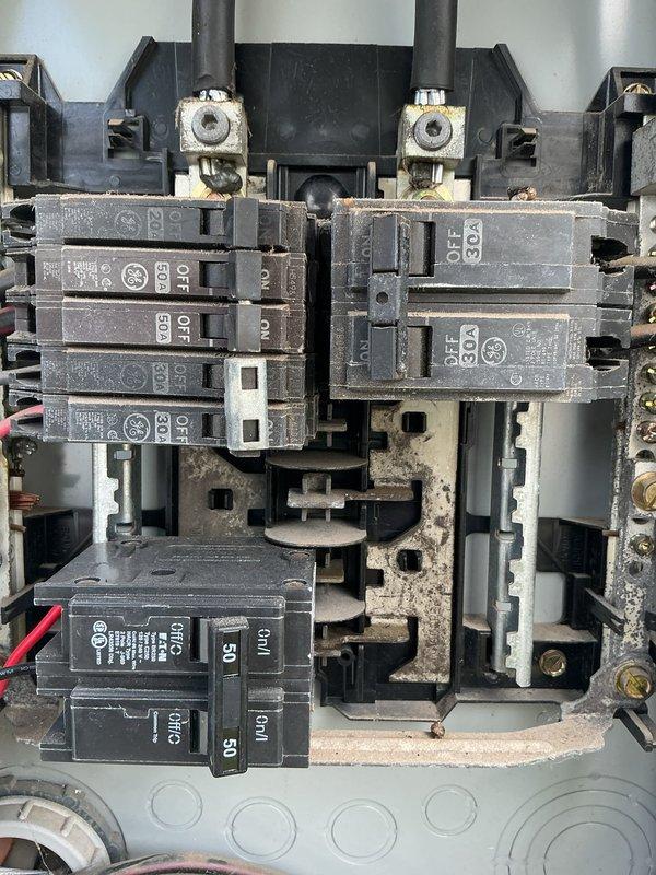 Installed outdoor power inlet box with 25-amp circuit breaker for generator connection at residential property. Connected new inlet box to existing main electrical panel, establishing safe transfer point for portable generator power. Assessed main panel condition during connection work, noting accumulated dust and debris throughout interior components. Verified proper breaker sizing and secure terminations at both inlet box and main panel locations. Installation provides homeowner with code-compliant generator hookup capability for backup power needs.