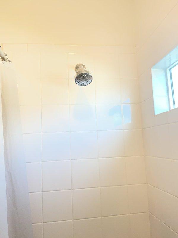 Completed comprehensive plumbing maintenance inspection on 2-year-old residential property. Inspected single 2-year-old electric water heater located in garage and verified proper operation. Performed visual inspection of bathroom plumbing fixtures including faucets, drains, and shower assembly, confirming all components functioning properly with no visible leaks or issues detected.