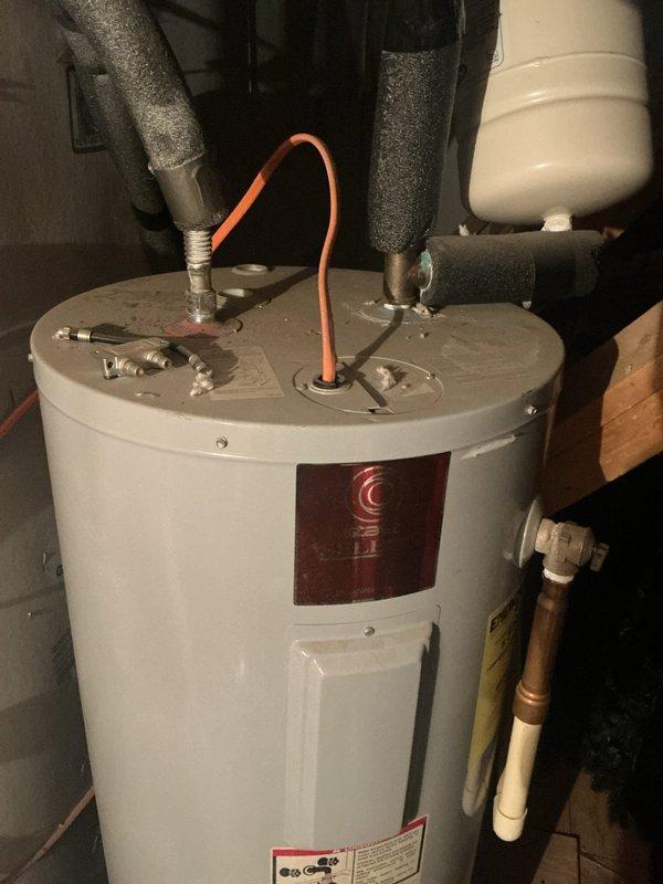 Completed comprehensive plumbing maintenance inspection on residential property with focus on two 13-year-old electric tank water heaters located in attic and bathroom plumbing fixtures. Performed visual inspection of both water heater units, examining connections, pressure relief valves, supply lines, insulation, and overall condition of tanks noting visible discoloration on front panel of primary unit. Tested and verified proper operation of bathtub fixtures including faucet assembly, single-handle shower control, and drainage system with all components functioning within normal parameters.