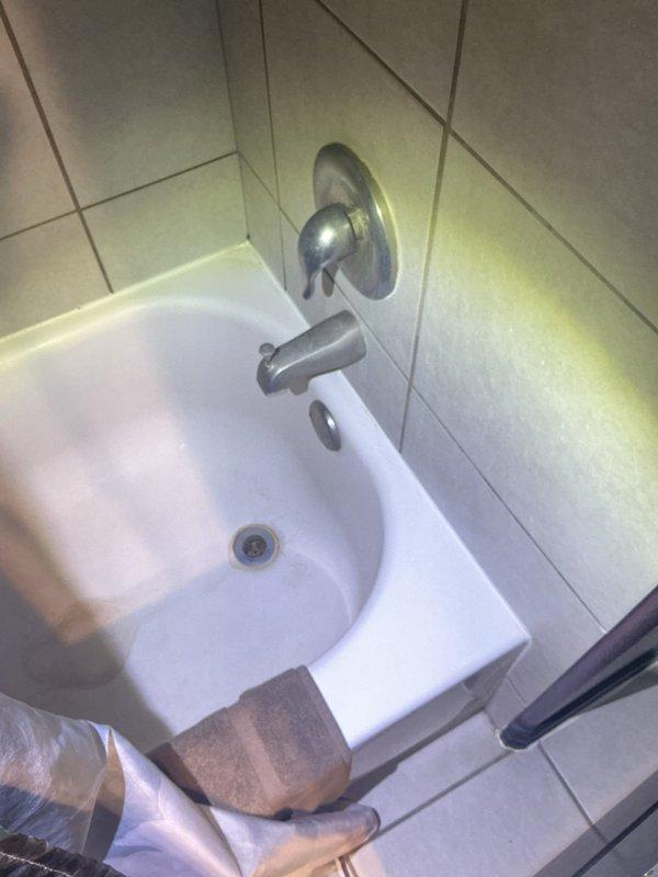 Completed comprehensive plumbing maintenance inspection on residential property with focus on two 13-year-old electric tank water heaters located in attic and bathroom plumbing fixtures. Performed visual inspection of both water heater units, examining connections, pressure relief valves, supply lines, insulation, and overall condition of tanks noting visible discoloration on front panel of primary unit. Tested and verified proper operation of bathtub fixtures including faucet assembly, single-handle shower control, and drainage system with all components functioning within normal parameters.