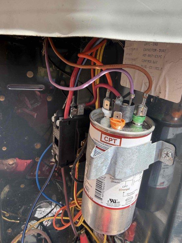 Completed spring maintenance on an 11-year-old single HVAC system located in the attic. Performed comprehensive inspection of all electrical components including contactor, capacitor, and control wiring. Verified proper connections on dual-run capacitor rated at 40+7.5 MFD, 370/440VAC, inspected contactor operation and terminal integrity, and documented condition of all wire connections throughout the control panel. System operating within normal parameters with no hot or cold spots reported and adequate performance on high-temperature days.