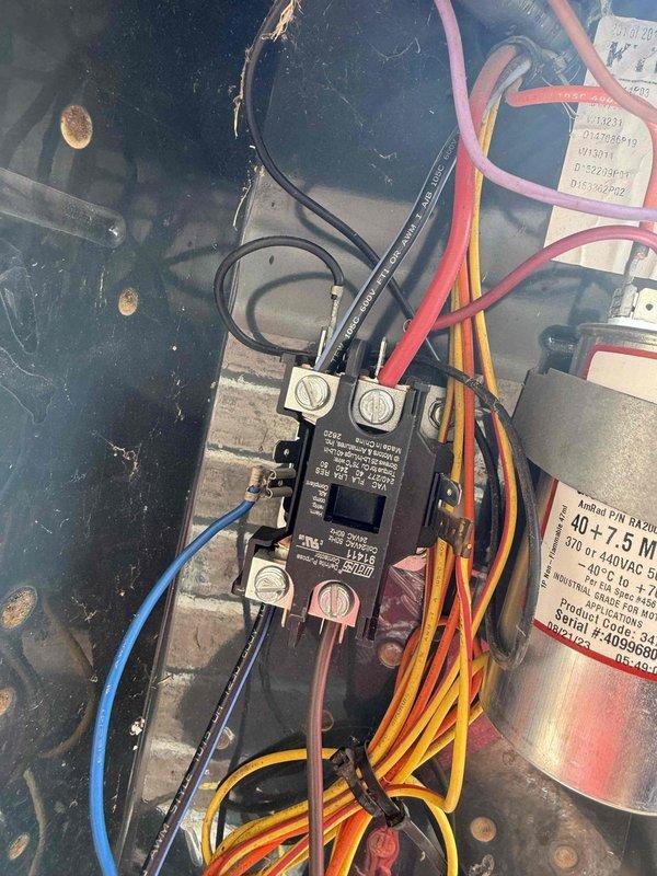 Completed spring maintenance on an 11-year-old single HVAC system located in the attic. Performed comprehensive inspection of all electrical components including contactor, capacitor, and control wiring. Verified proper connections on dual-run capacitor rated at 40+7.5 MFD, 370/440VAC, inspected contactor operation and terminal integrity, and documented condition of all wire connections throughout the control panel. System operating within normal parameters with no hot or cold spots reported and adequate performance on high-temperature days.