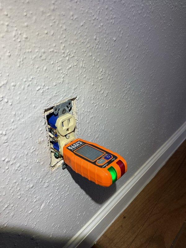 Responded to service call for outlet replacement and installation in residential property. Upon arrival, performed electrical safety testing using digital multimeter to verify circuit integrity and proper grounding. Removed existing defective duplex receptacle from wall-mounted electrical box, inspecting visible wiring and connections for code compliance and damage. Replaced two worn outlets with new beige duplex receptacles, ensuring proper wire termination to brass and silver terminal screws and secure ground connection. Installed one additional outlet as requested, verifying proper wire gauge and circuit capacity. Tested all receptacles under load to confirm correct polarity, grounding, and functionality. Secured devices to electrical boxes with appropriate mounting hardware and reinstalled cover plates. All work performed in accordance with current NEC standards.