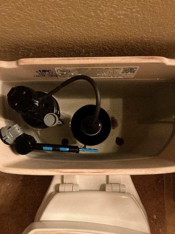 Responded to kitchen sink leak and completed comprehensive plumbing maintenance inspection. Addressed the immediate leak under the kitchen sink, identifying and repairing the source of water intrusion. Performed full plumbing system evaluation including inspection of toilet tank components, fill valve assembly, and flapper mechanism. Documented condition of interior tank components showing normal mineral deposits and water staining consistent with the 25-year-old home. Inspected water heater unit located in garage closet, confirmed operational status of the under-5-year-old tank system. All fixtures tested for proper operation, drainage verified throughout, and no additional leaks detected upon completion of repairs and maintenance service.