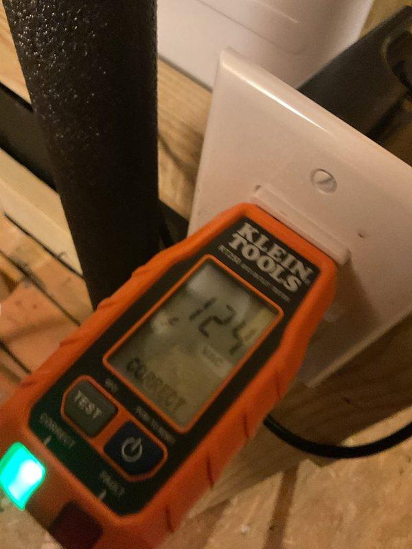 Installed dedicated electrical outlet for tankless water heater system in coordination with plumbing installation. Verified proper voltage at newly installed receptacle using digital multimeter, confirming 120V supply. Outlet mounted on interior wall adjacent to tankless unit location with appropriate wire gauge and circuit protection for appliance requirements. All electrical work completed to support plumbing contractor's tankless water heater installation.