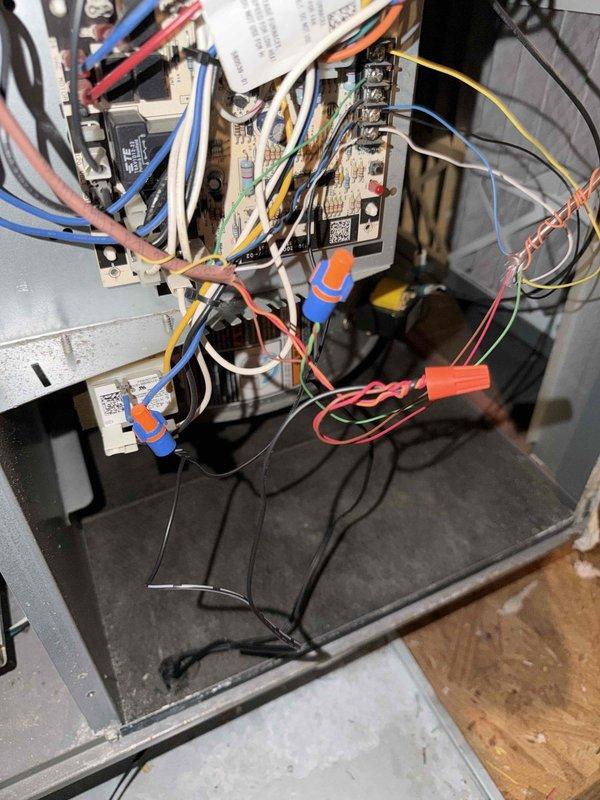 Responded to service call for non-functioning thermostat display on 8-10 year old HVAC system. Inspected Honeywell Home Smart thermostat and traced low voltage wiring to air handler control board, where loose wire connections were identified and secured with proper terminations. Verified system operation and restored thermostat functionality upon completion.