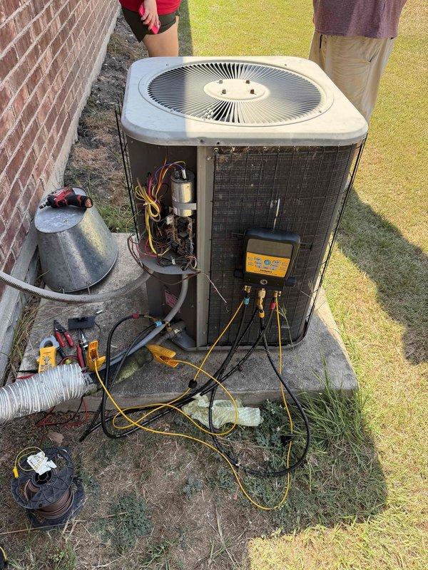 Responded to service call for non-operational central air conditioning system in 16-year-old residential property. Upon arrival, performed comprehensive diagnostic evaluation of outdoor condenser unit. Removed service panel to access internal components and connected manifold gauge set to refrigerant lines to assess system pressures and refrigerant charge levels. Utilized digital multimeters to test electrical components including compressor, capacitor, and associated wiring connections. Verified proper voltage supply by inspecting main electrical panel and confirmed dedicated 240V circuit breaker for air conditioner was functioning correctly. Conducted thorough system analysis to identify root cause of failure, testing both electrical and mechanical components of the condensing unit. All diagnostic equipment and recovery cylinder were properly deployed on-site to facilitate complete system evaluation and potential refrigerant recovery if necessary.