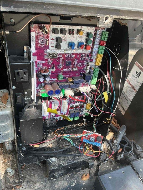 Responded to no power condition at walkway gate magnetic lock. Performed voltage testing and diagnostic inspection of gate control panel and associated electrical components. Utilized digital multimeter to verify power supply, circuit integrity, and control board functionality. Inspected magenta control board, relay connections, terminal blocks, and wiring harness for loose connections, damaged components, or signs of environmental exposure. Assessed condition of internal panel components including circuit protection devices and identified debris accumulation at panel base. Verified proper grounding and connection integrity throughout control system to restore power to magnetic lock mechanism.
