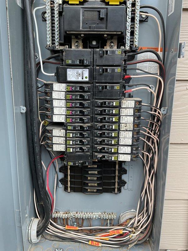Removed existing surge protection device from main electrical panel and properly sealed the knockout hole at the bottom of the enclosure. Installed a new secondary breaker-style surge protector in the main distribution panel and connected the neutral wire to the appropriate grounding bar, ensuring proper whole-house surge protection with 5-year warranty coverage.