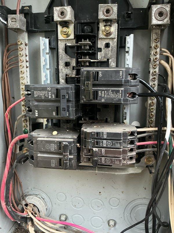 Responded to service call for dryer breaker replacement and inspection of previously installed 50-amp RV outlet. Upon arrival, conducted thorough inspection of main electrical panel in 1990s-era home. Panel showed signs of age with accumulated dust, debris, and minor corrosion on terminal blocks and bus bars. 

Installed new circuit breaker for electric dryer to restore proper operation. Verified proper amperage rating, secure wire connections, and correct placement within panel. Tested breaker functionality and confirmed dryer circuit operational.

Inspected 50-amp RV outlet circuit that was previously installed by our company. Evaluated wiring connections, circuit integrity, and outlet performance to diagnose reported issues. 

During panel inspection, identified critical safety deficiency: absence of proper gas and water line bonding. This condition creates a shock hazard, as gas and water piping systems can become energized without a safe path for leaked voltage to return to earth.