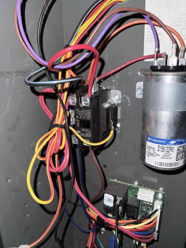 # HVAC Service Completed

Responded to service call for air conditioning system intermittently shutting off. Upon arrival, performed diagnostic inspection of electrical control system. Accessed control panel and examined all electrical components including capacitor, contactor relay, and low-voltage control board. 

Inspected all wire connections at capacitor terminals, contactor terminals, and control board connection points for signs of loose connections, overheating, or deterioration. Verified proper wire routing and secure terminations across all colored control wiring including thermostat wiring and power supply connections. Examined capacitor for bulging, leaking, or other signs of failure that could cause intermittent system operation.

Tested electrical connections at terminal blocks and verified integrity of all low-voltage control circuits. Documented current condition of all electrical components with photographs showing capacitor, contactor, control board, and associated wi