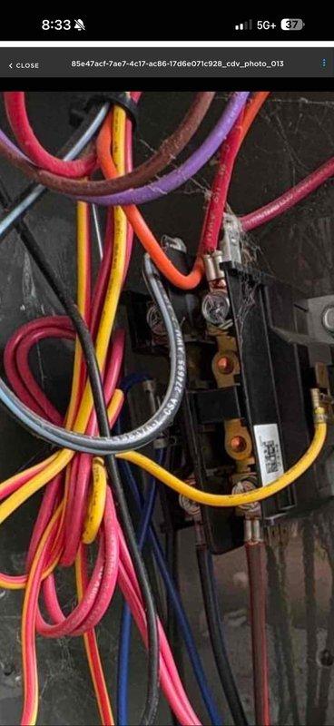 # HVAC Service Completed

Responded to service call for air conditioning system intermittently shutting off. Upon arrival, performed diagnostic inspection of electrical control system. Accessed control panel and examined all electrical components including capacitor, contactor relay, and low-voltage control board. 

Inspected all wire connections at capacitor terminals, contactor terminals, and control board connection points for signs of loose connections, overheating, or deterioration. Verified proper wire routing and secure terminations across all colored control wiring including thermostat wiring and power supply connections. Examined capacitor for bulging, leaking, or other signs of failure that could cause intermittent system operation.

Tested electrical connections at terminal blocks and verified integrity of all low-voltage control circuits. Documented current condition of all electrical components with photographs showing capacitor, contactor, control board, and associated wi