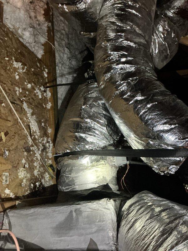 Installed zone damper in attic ductwork system to enable independent temperature control for designated area. Secured damper assembly with proper mounting hardware and verified operational functionality of motorized damper blade. Inspected existing flexible ductwork connections and insulation integrity throughout accessible attic space to ensure system readiness for zoned operation.
