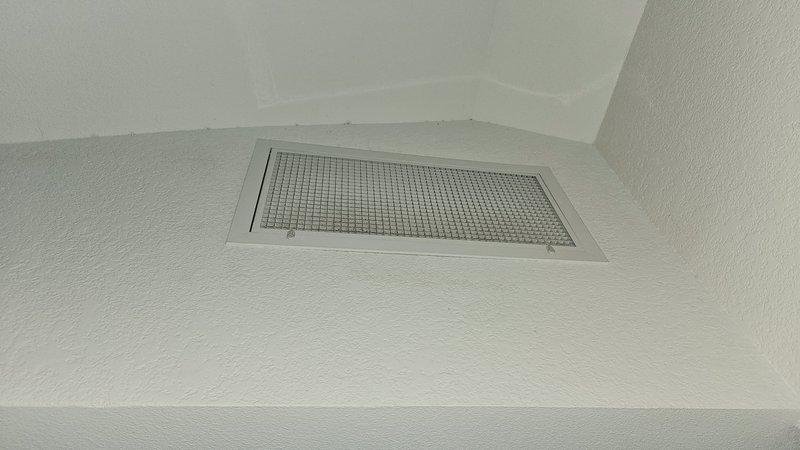Responded to service call for damaged ductwork in 1984 residential property with 2020 HVAC system. Customer had removed a 2-foot section of supply or return ductwork due to water damage in basement utility area. Conducted thorough inspection of accessible ductwork system throughout the property, including visual assessment of ceiling-mounted register locations and basement mechanical room installation. Documented condition of existing duct runs, identifying multiple additional sections showing deterioration, compromised insulation, and potential air leakage points that require repair or replacement. Photographed damaged areas and current system configuration, including air handler unit with connected ductwork and reflective foil-faced insulation wrap. Assessed overall ductwork integrity and noted areas where water intrusion has affected structural stability of ducting material. Provided recommendations for ductwork replacement and repair to restore proper system airflow, maintain energ