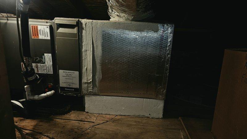 Responded to service call for damaged ductwork in 1984 residential property with 2020 HVAC system. Customer had removed a 2-foot section of supply or return ductwork due to water damage in basement utility area. Conducted thorough inspection of accessible ductwork system throughout the property, including visual assessment of ceiling-mounted register locations and basement mechanical room installation. Documented condition of existing duct runs, identifying multiple additional sections showing deterioration, compromised insulation, and potential air leakage points that require repair or replacement. Photographed damaged areas and current system configuration, including air handler unit with connected ductwork and reflective foil-faced insulation wrap. Assessed overall ductwork integrity and noted areas where water intrusion has affected structural stability of ducting material. Provided recommendations for ductwork replacement and repair to restore proper system airflow, maintain energ