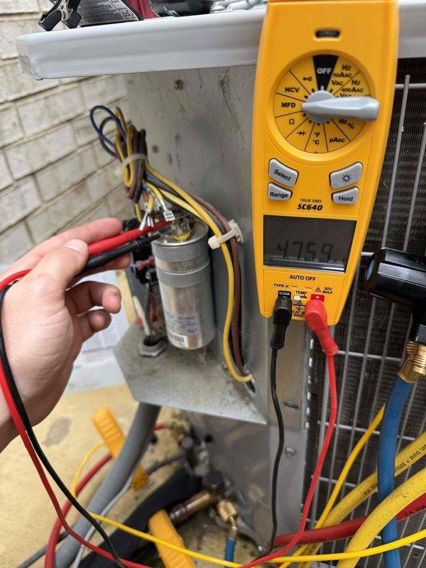 # HVAC Service Completed

Responded to service call for air conditioning system experiencing freeze-up conditions and reduced airflow. Unit is approximately 2 years old in a home built in 2022, with no maintenance performed since installation.

Upon arrival, performed comprehensive system diagnostics. Used Fieldpiece SC640 multimeter to test electrical components in outdoor condensing unit. Measured capacitor values to verify proper operation of compressor and condenser fan motor. Inspected electrical connections, wiring, and control components within the outdoor unit's service panel.

Conducted thorough inspection of indoor air handler unit. Examined evaporator coil section and blower compartment. Found evidence consistent with restricted airflow conditions that would lead to coil freeze-up. Inspected blower assembly, return air pathways, and internal ductwork connections.

Primary issue identified as lack of preventative maintenance over two-year period resulting in compromised syste
