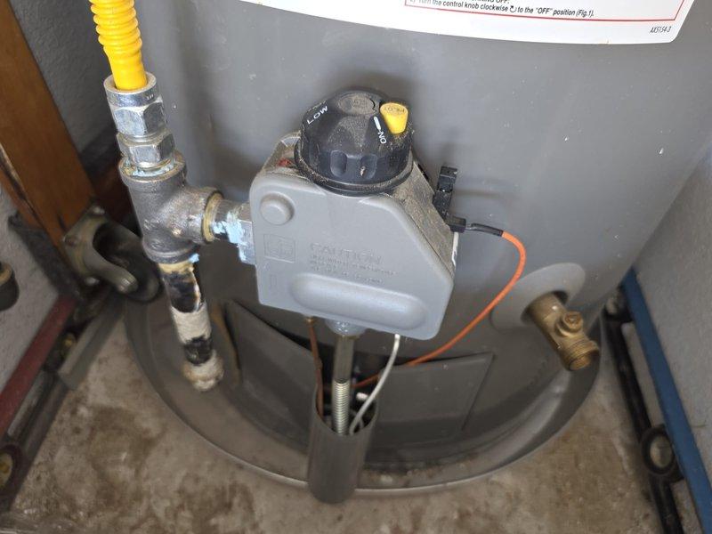 Completed comprehensive plumbing maintenance on a 5-year-old gas tank water heater located in the garage. Performed full system inspection including gas control valve assembly, temperature and pressure relief valve, gas line connections, and all pipe fittings. Tested water quality and collected sample for analysis, which showed acceptable parameters indicated by blue test results. Verified proper operation of gas control valve with HOT/LOW settings, inspected yellow flexible corrugated stainless steel gas line for leaks and proper connection, and confirmed all safety devices including thermocouple assembly were functioning correctly. All components found to be in good working condition with no immediate repairs needed.