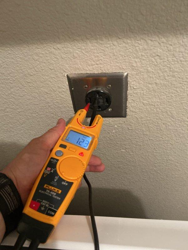 Responded to no-power complaint on electric dryer circuit following referral from appliance repair technician. Upon arrival, verified dryer outlet was not delivering proper voltage using calibrated Fluke multimeter. Tested receptacle under load and confirmed absence of 240V supply to dryer location. Traced circuit back to main electrical panel and identified tripped breaker on dedicated dryer circuit. Inspected breaker for signs of failure, overheating, or damage. Reset breaker and verified restoration of proper voltage at dryer receptacle, measuring 240V across both hot legs. Cycled dryer to confirm operational power supply and proper circuit function. Performed visual inspection of 20-year-old electrical panel for any additional concerns including signs of corrosion, loose connections, or outdated components. All testing confirmed circuit integrity restored and dryer receiving appropriate power for normal operation.