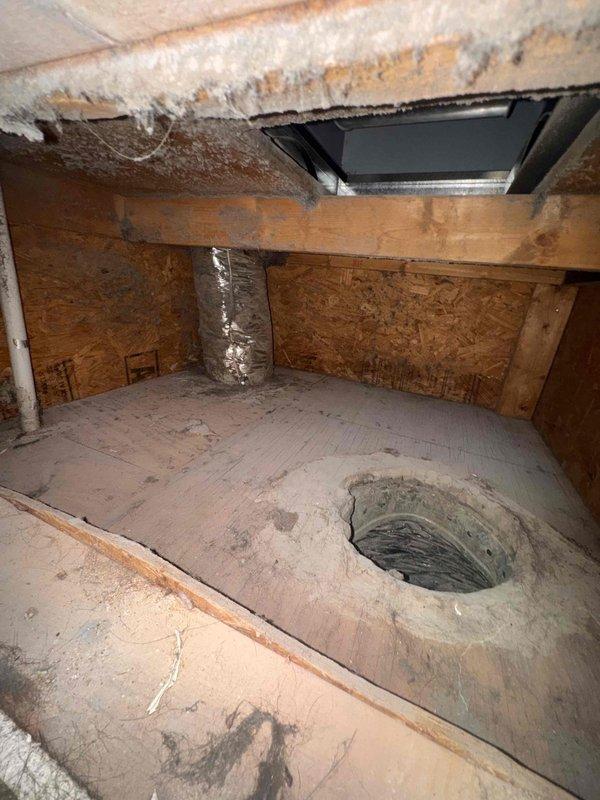 Responded to service call for abnormal evaporator coil temperature drop on 5-year-old HVAC system. Accessed attic-mounted air handler and retrieved diagnostic fault codes from unit control board, which indicated F04 error with elevated temperature readings of 1069 degrees. Performed visual inspection of air handler cabinet and plenum area, noting continued presence of organic growth and deteriorated insulation conditions observed during previous visit four days prior. Verified evaporator coil temperature differential exceeded manufacturer specifications, likely related to restricted airflow from biological contamination in plenum and ductwork that remains unaddressed. Documented attic conditions including soiled flooring, compromised insulation integrity, and access opening to lower space. Recommended immediate plenum replacement and comprehensive duct cleaning to resolve airflow restriction issues and prevent compressor damage from abnormal operating pressures caused by reduced heat e