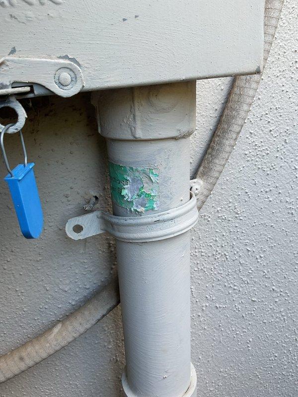 Completed electrical member maintenance inspection on residential property with dual breaker panel configuration located at exterior and garage positions. Performed comprehensive visual assessment of electrical disconnect box, verifying wire terminations, connection integrity, and proper torque on terminal block screws. Inspected external PVC conduit runs and mounting hardware for physical damage, noting areas of paint deterioration and surface corrosion on exterior conduit assembly requiring monitoring. Documented panel conditions and exterior electrical infrastructure with photographic records for maintenance history files.