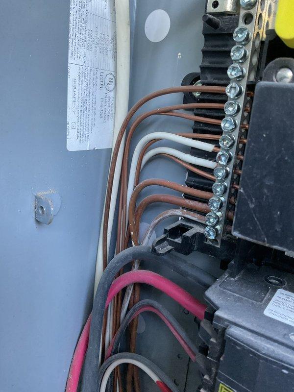 Completed electrical member maintenance inspection on residential property with dual breaker panel configuration located at exterior and garage positions. Performed comprehensive visual assessment of electrical disconnect box, verifying wire terminations, connection integrity, and proper torque on terminal block screws. Inspected external PVC conduit runs and mounting hardware for physical damage, noting areas of paint deterioration and surface corrosion on exterior conduit assembly requiring monitoring. Documented panel conditions and exterior electrical infrastructure with photographic records for maintenance history files.