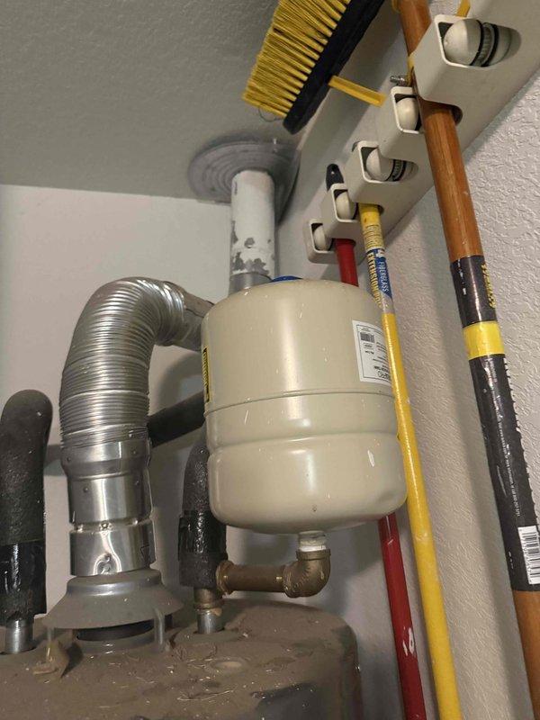 Responded to emergency plumbing call for failed expansion tank and active leak in upstairs bathroom. Upon arrival, confirmed expansion tank had lost pressure (dropped to 25 lbs) and was no longer functioning properly. Assessed water damage in upstairs bathroom and identified ongoing moisture issues requiring attention. Replaced failed expansion tank with new unit, restored proper system pressure, and tested all connections for leaks. Inspected associated plumbing components including pressure relief valve and supply lines. Provided customer with multiple service options including expansion tank replacement only, comprehensive pressure control valve installation with water cutoff and wall repairs, and toilet servicing. Customer approved expansion tank replacement to restore immediate system functionality. Documented residual water damage in bathroom for customer awareness and potential future remediation. System now operating within normal parameters with proper thermal expansion protec