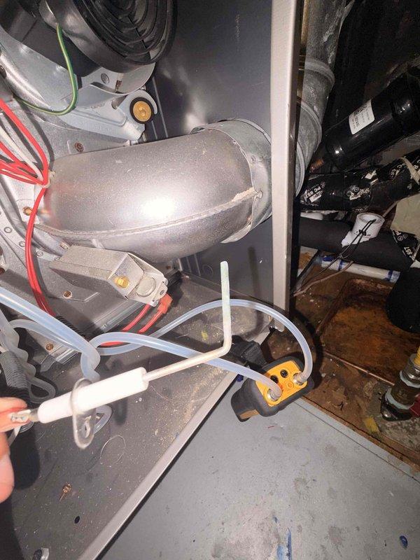 Completed comprehensive member maintenance service on residential HVAC system located in attic space. Performed full system inspection of air handler unit, including examination of blower motor assembly, electrical connections, and drainage components. Verified proper operation of condensate pump and associated clear drainage tubing, ensuring unobstructed flow and secure connections. Inspected ductwork with reflective insulation for proper sealing and condition. Examined all electrical wiring connections, including red and white wire runs to system components. Checked mounting brackets and hardware for secure installation. Noted normal dust accumulation consistent with regular system operation and some minor surface discoloration on interior cabinet panels from age-related wear. All system components found operating within normal parameters. System confirmed functional and ready for continued service.
