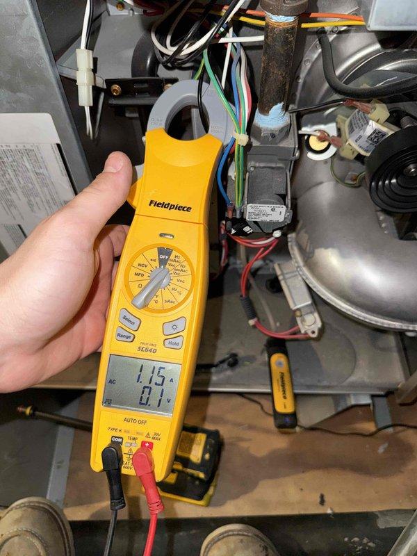 Performed fall member maintenance on 8-year-old HVAC system located in attic. During inspection, identified failing blower motor and inducer motor requiring replacement. Utilized clamp meter to measure amperage draw at 1.15 amps and voltage at 81V, confirming motor performance issues. Presented three repair options: Option A includes replacement of both blower motor and inducer motor, Option B addresses blower motor replacement only, and Option C covers inducer motor replacement only. System accessible with clean work area. Unit currently operational but components showing signs of wear consistent with system age. Recommend addressing identified motor issues to prevent future system failure and maintain efficiency.