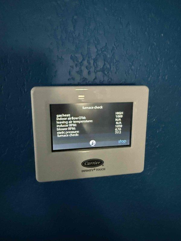 Completed member maintenance on a single-zone Carrier Infinity gas furnace system located in attic. Performed comprehensive system diagnostics using Carrier Infinity Touch thermostat, verifying furnace operation parameters including gas heat function, indoor airflow CFM (1009 CFM on high), leaving air temperature, delta T, blower RPM (870), and static pressure (7:12). Inspected burner assembly, gas valve connections, and flexible gas line for proper installation and safety compliance. Verified all electrical connections, wiring harnesses, and transformer components for secure mounting and proper voltage. System operating within manufacturer specifications at time of inspection.