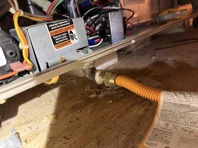 Completed member maintenance on a single-zone Carrier Infinity gas furnace system located in attic. Performed comprehensive system diagnostics using Carrier Infinity Touch thermostat, verifying furnace operation parameters including gas heat function, indoor airflow CFM (1009 CFM on high), leaving air temperature, delta T, blower RPM (870), and static pressure (7:12). Inspected burner assembly, gas valve connections, and flexible gas line for proper installation and safety compliance. Verified all electrical connections, wiring harnesses, and transformer components for secure mounting and proper voltage. System operating within manufacturer specifications at time of inspection.