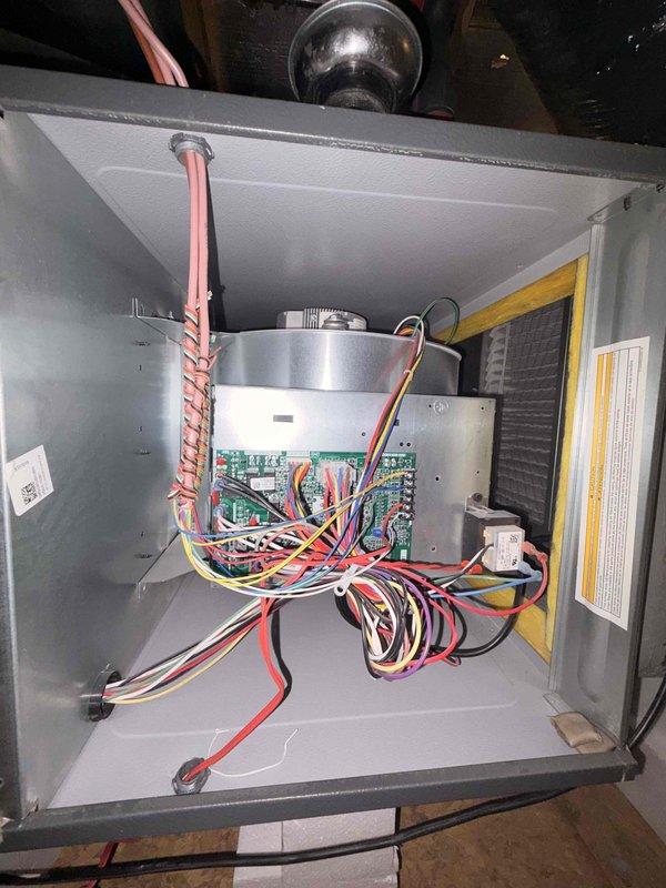 Completed first preventive maintenance visit on a newly installed combo HVAC system located in attic of new construction home. Performed comprehensive inspection of indoor air handler control board, wiring connections, and blower motor assembly. Verified all electrical connections secure within control cabinet and documented proper wire terminations. Proceeded to outdoor condensing unit where electrical amperage draw was measured at 40.8 amps using clamp meter, confirming compressor operating within normal parameters. Inspected condenser coil fins, refrigerant line connections, and service valves. All components found operating properly with no issues reported by homeowner regarding temperature control or system performance. System running efficiently with no hot or cold spots detected throughout 2,022 square foot residence. Attic access was clean, safe, and accessible for service work. No repairs or adjustments required at this time.